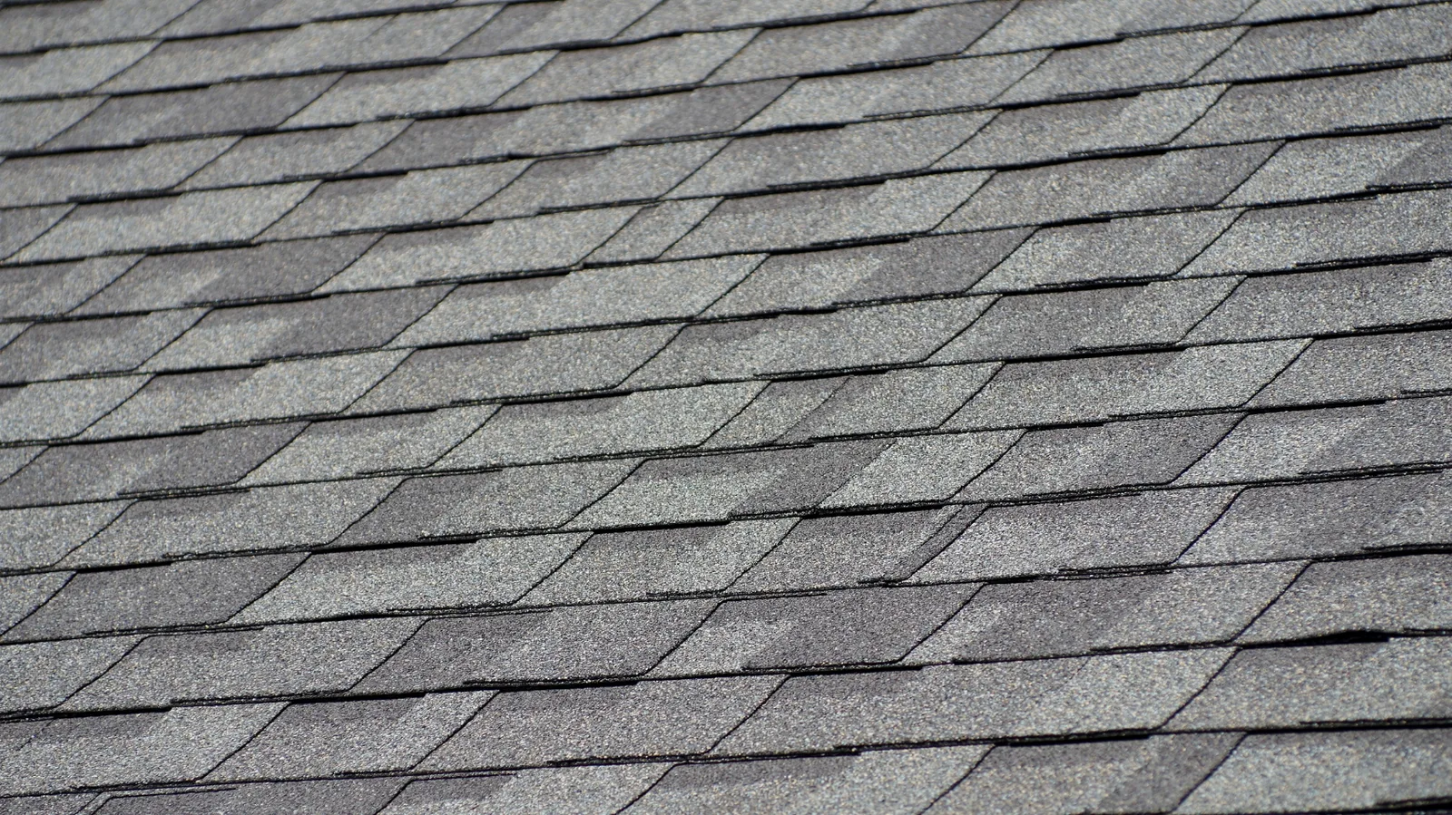Gray asphalt shingles with a regular rectangular tab pattern